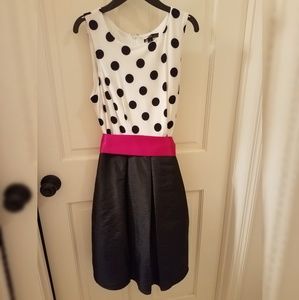Black and white dress with raspberry-pink sash